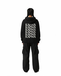 byKapwa Studio | Kapwa Repeat Hoodie - Dark | Hoodie Schwarz | Model Frau Rückseite