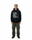 byKapwa Studio | Team Extra Rice Hoodie - Dark | Hoodie Schwarz | Model Mann Vorderseite